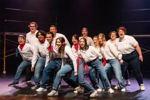 Group of actors leaning to the left in Working: The Musical Theatre production.