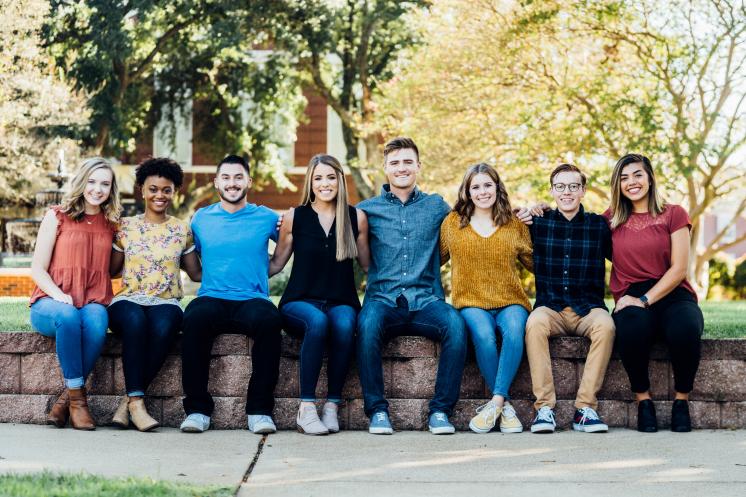 Students on a wall Students on a wall