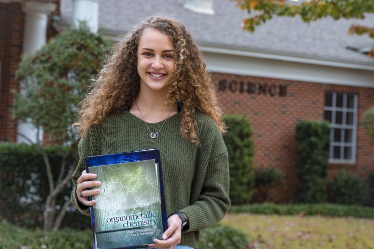 Chemistry Student with Textbook