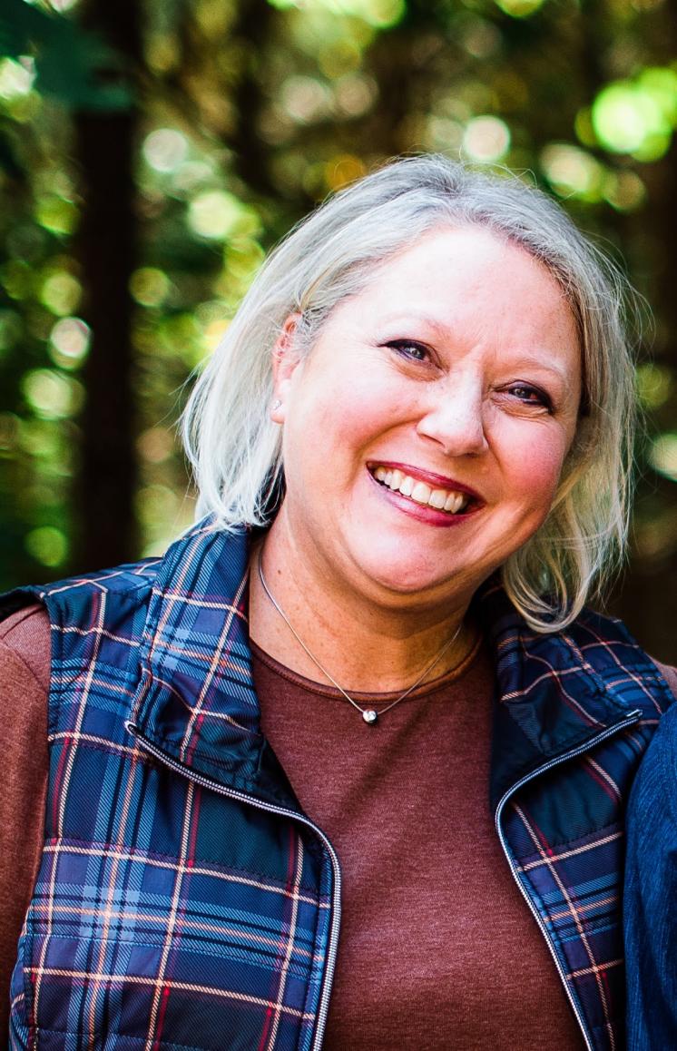 Woman smiling at the camera outside