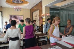 a group of people inside working on a table