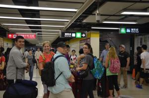 people standing insidea station together