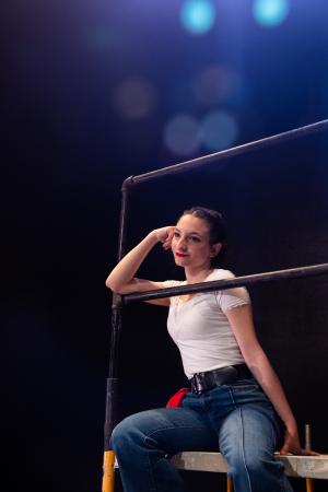 Woman sitting in Working: The Musical Theatre production.