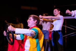  Group of actors with hands extended outwards in Working: The Musical Theatre production.