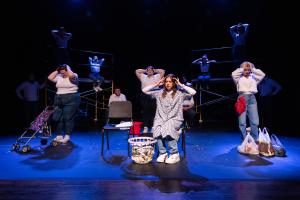 Group of three women holding their heads in Working: The Musical Theatre production.