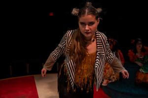 Woman standing with angry look during Cagebirds Theatre Production