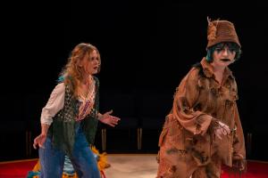 woman walking away from irritated woman during Cagebirds Theatre Production