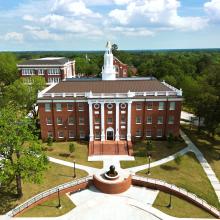 A drone image of a brick academic building at East Texas Baptist University