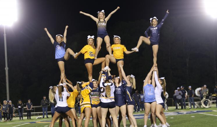 ETBU Tiger Cheer builds a pyramid at the Tiger Pep Rally on Friday evening. The student-led pep rally also featured performances by Tiger Pom and the ETBU Band.