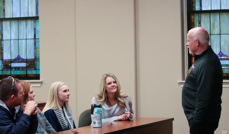 An ETBU professor speaks with a visiting family