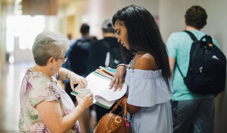 An ETBU professor helps a student 