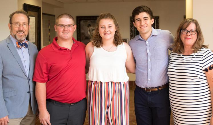 ETBU nursing students Colby Simmons, Stacie Simmons, and Joshua Hartley receive the Polly Cargill Scholarship during the reception held at the newly opened Marshall Grand.