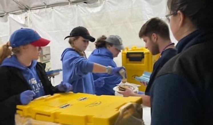 Group of students serving food
