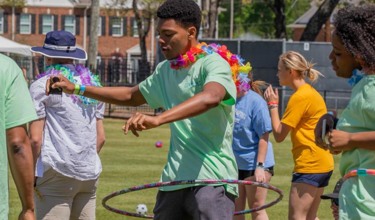 2022_connexus_img_3 Man hoola hooping outside with other people around him