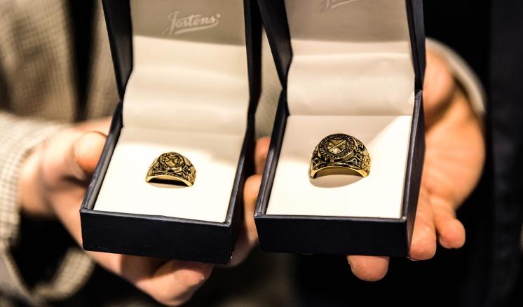 2022_ring_blessing_fall_img_2 Close up picture of two graduation rings in the ring boxes