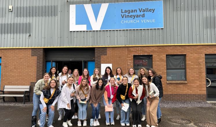Group of people posing in front of the Lagan Valley Vineyard building.