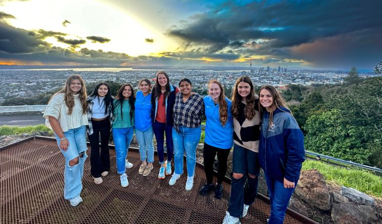 Women's Soccer TAME | New Zealand Group of women smiling at the camera outside