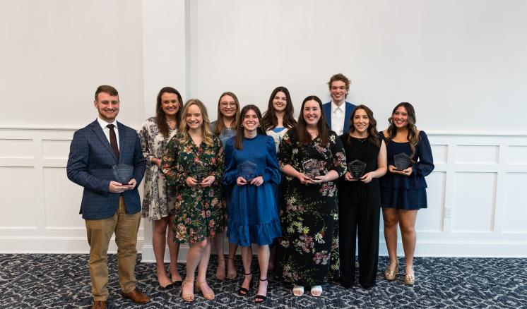2024_presidential_scholar_society_dinner_0127 Eleven ETBU students stand together in a group after being presented with the ETBU Presidential Scholar Award