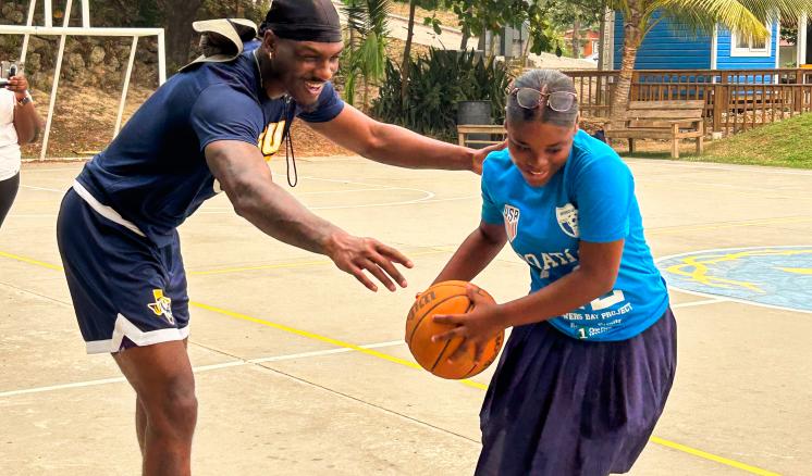 img_8805 ETBU Men's Basketball player plays a game of basketball with a student in Honduras