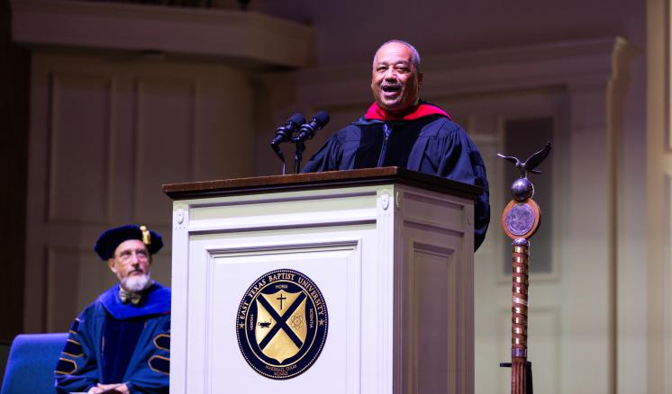 20240909_convocation_0132 Fred Luter stands behind the podium to address the audience at ETBU's fall 2024 convocation