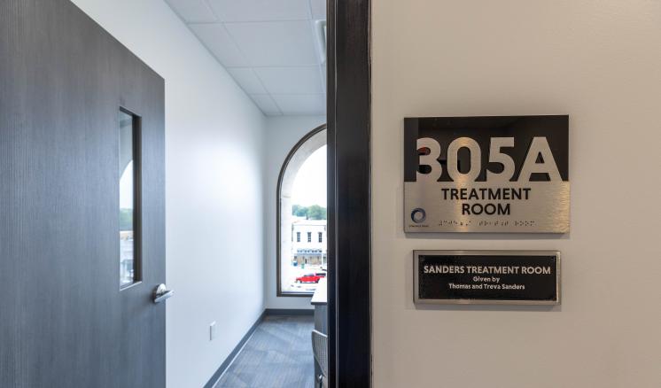 Inside of a building with "Treatment room" Labeled on the door for SPLP services