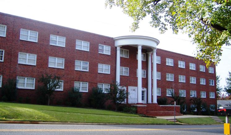 feagin_hall_street_view.jpg Historical color photo of the front of Feagin Hall at East Texas Baptist University, a red brick building with white columns.