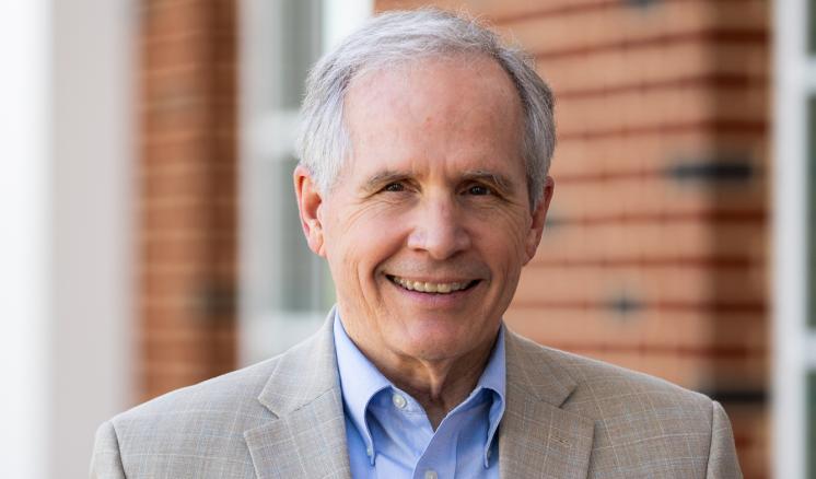 A man standing outside in formal attire