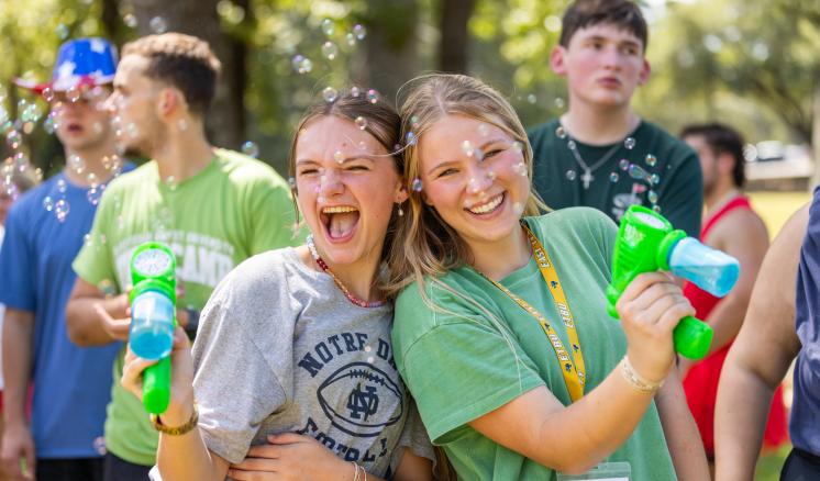 two girls with water guns