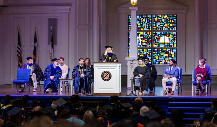 Dr. Hedgepath behind a podium