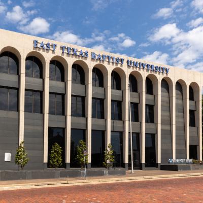The exterior of a building with writing that says, "East Texas Baptist University"