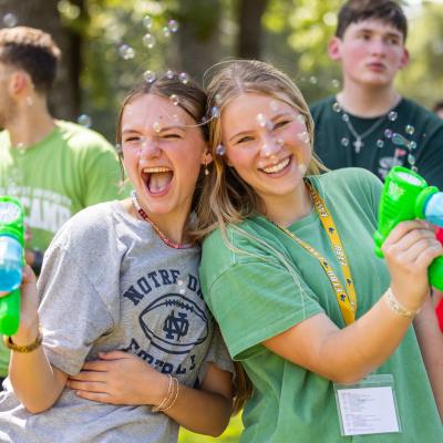 two girls with water guns