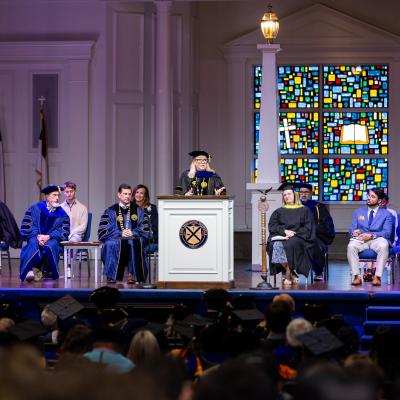 Dr. Hedgepath behind a podium