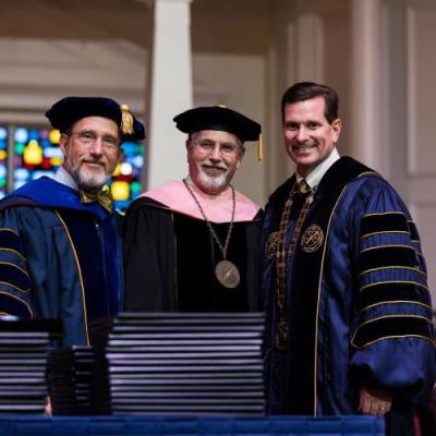 3 men in academic regalia