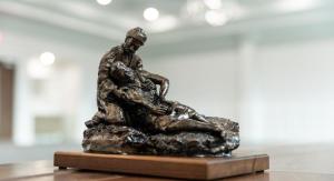 Bronze statue on wooden table
