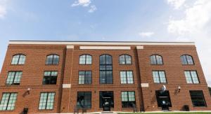 Red brick residence hall with blue sky in the back