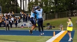 Two football players jumping in joy after a touch down