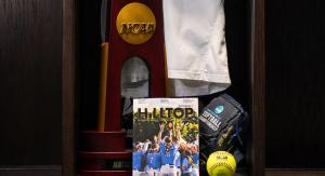 Display of sports memorabilia, including a championship trophy, Hilltop Magazine, basketball, and jersey in a locker.