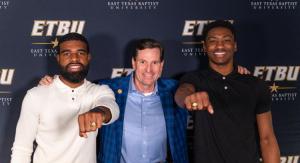 Dr. Blackburn with two male students at senior ring blessing 