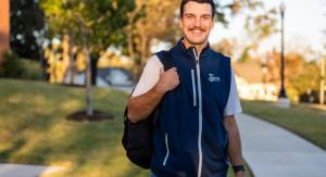 A male student with a backpack over one shoulder