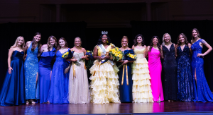 A group of women standing on a stage with the center lady wearing a Miss ETBU 2025 sash