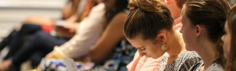 Students taking notes during the Calling Conference