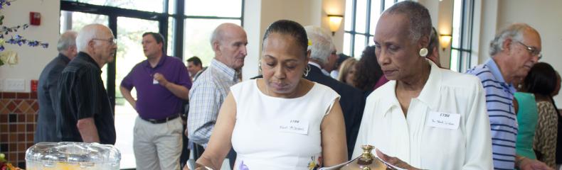 People gathering, talking, and eating together