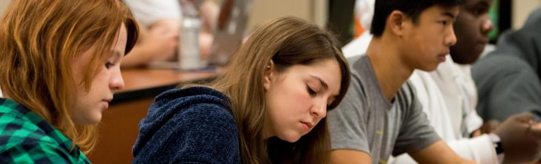 During the Introduction to New Testament Mini-Term with Assistant Professor of Religion Jeremy Greer, junior Chloe Wright, freshman Lauren House, and freshman Eric Hood take notes. 