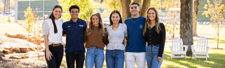 A group of young people standing next to each other
