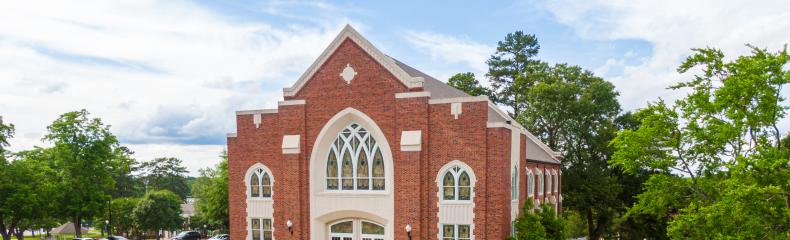 A drone image of a brick academic building at East Texas Baptist University