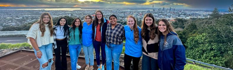 Group of women smiling at the camera outside