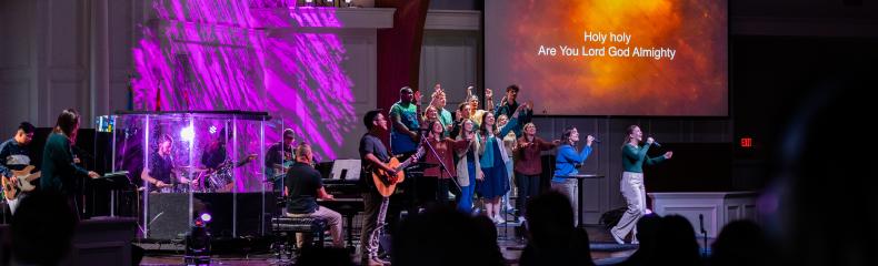 Group of students leading worship in a chapel 