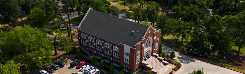Drone image of brick academic building 