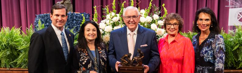 President Blair Blackburn and First Lady Michelle Blackburn stand with Dr. David Dykes and Cindy Dykes following Dr. Dykes being presented with the Servant Leadership Award