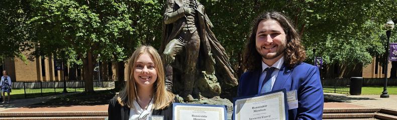 Two students hold awards received at the East Texas Regional Phi Alpha Theta Conference 2024